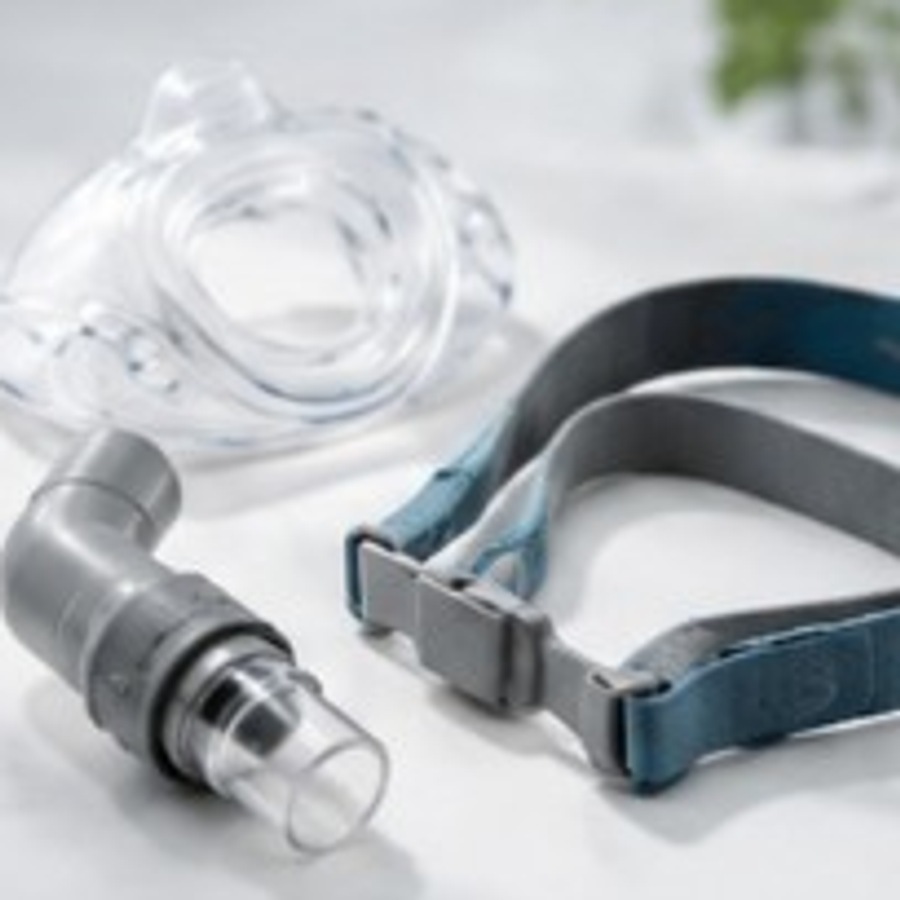 CPAP replacement parts including a cushion, elbow connector, and headgear